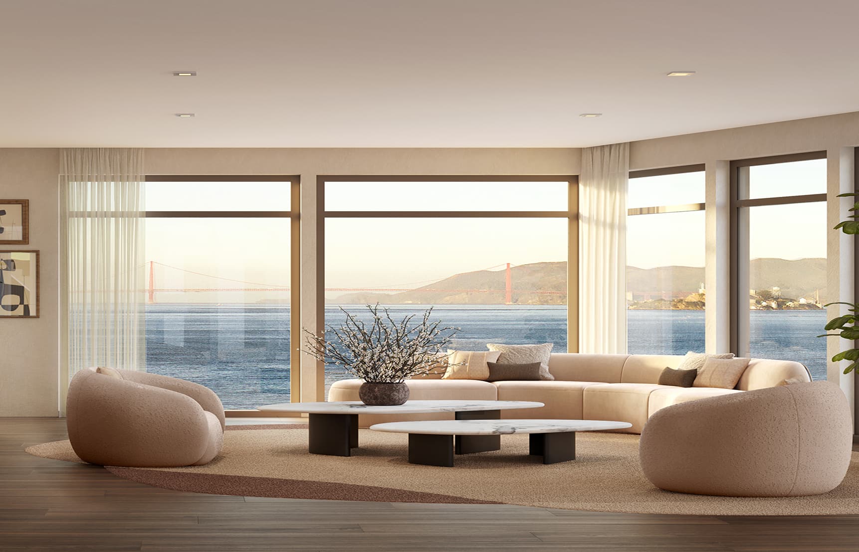 Modern waterfront living room at 490 Avenue of the Palms featuring floor-to-ceiling windows with panoramic views of San Francisco Bay and the Golden Gate Bridge, warm neutral interiors, and contemporary furnishings.