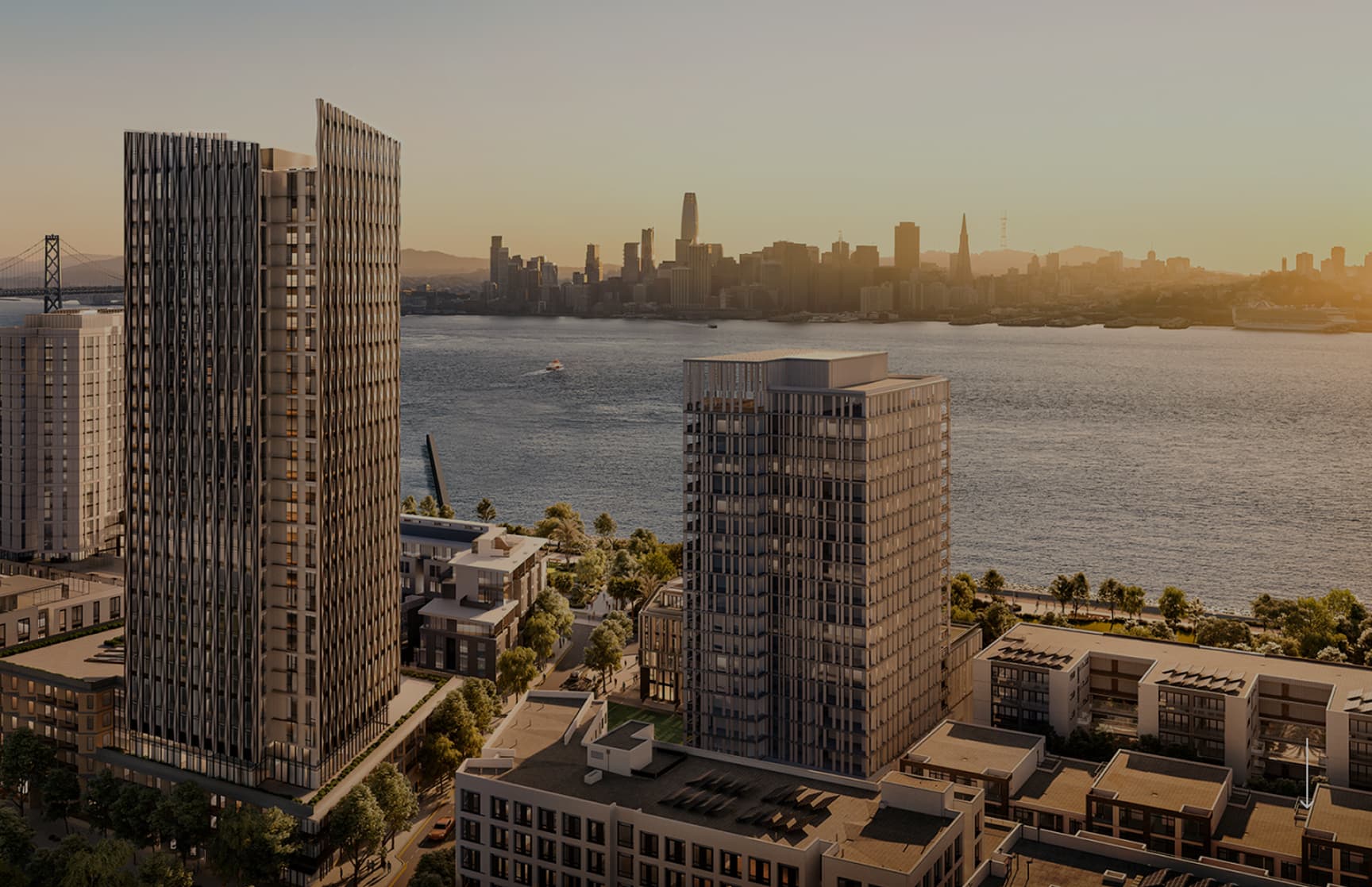 Rendering of modern residential towers and mid-rise buildings along the waterfront at Treasure Island, with the San Francisco skyline across the bay in warm evening light.