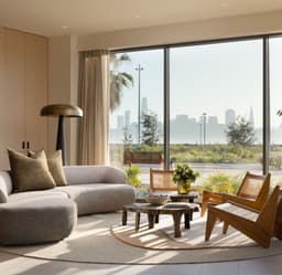 nterior lounge at 490 Avenue of the Palms with modern seating, floor-to-ceiling windows, and views toward the San Francisco skyline.
